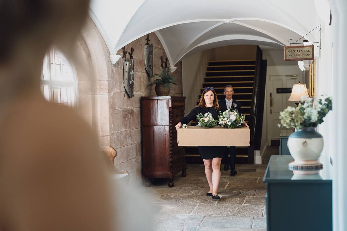 Flowers arriving through the entrance hall