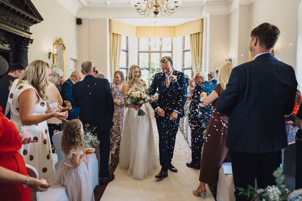 Just married, through the confetti in the Library